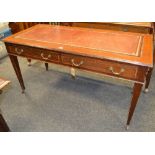 An Edwardian mahogany writing desk, tooled leather inlaid top, two drawers to frieze,