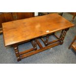 An oak nested coffee table, rectangular moulded top,