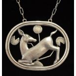 A Georg Jensen sterling silver kneeling deer oval pendant and chain No.