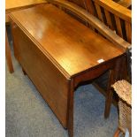 A George III mahogany drop leaf dining table, rectangular top,