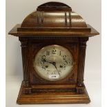 An early to mid 20th century mahogany mantel clock, twin winding holes,