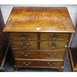 A 'George III' type flamed mahogany and walnut chest with moulded top above four drawers,