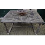 A large wooden extending patio table,