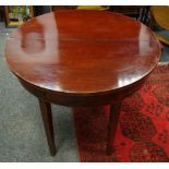 A George III mahogany tea table.