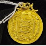 An early 20th century 9ct gold Football Association medal awarded to G.E.