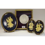 An early 20th century classical intaglio, framed; a near pair of Wedgwood type painted plaques,
