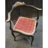 An ebonised corner chair shaped and inlaid cresting top rail,