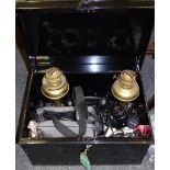 early 20th century metal trunk, with key; a pair of brass oil lamp bases; a Yashica, Praktica,