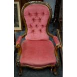 A Victorian spoon back button upholstered chair