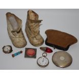 Bijouterie - a pair of 19th century baby shoes; an early 20th century silver compact, engine turned,