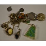 A silver and Blue John pendant; a silver scrolling link necklace, amber set; a silver locket,