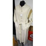 A full length lady's leather coat, pale cream, 1970's, belted, mandarin collar,