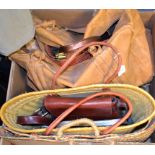 A large leather travelling bag, plaited handles; a rattan style bucket bag,