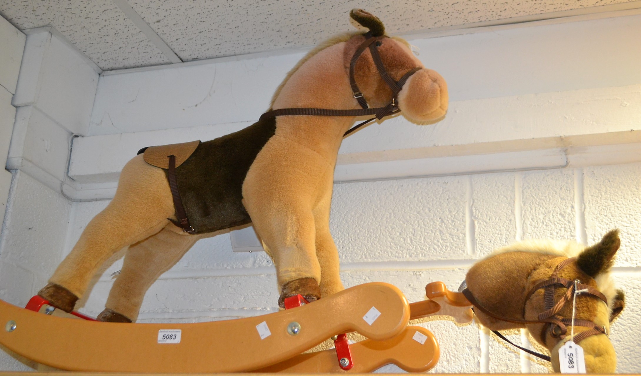 A Merrythought rocking horse on wooden rockers,