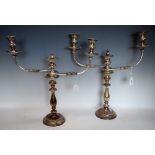 A pair of silver plated candelabra,