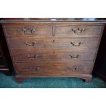 A George III mahogany chest of two short over three long graduated cockbeaded drawers,