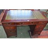 A mahogany twin pedestal desk