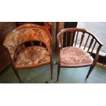 An Edwardian mahogany elbow chair, curved cresting and arm rails terminating in scrolls,