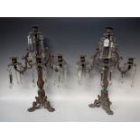 A pair of 19th century ornate cast metal candelabra lustres,