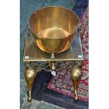 A substantial brass fireside trivet,