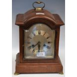 An oak bracket clock, silvered dial, Roman and Arabic numerals,