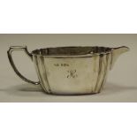 A silver cream jug,