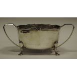A silver twin handled sugar bowl,