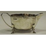 A silver cream jug,