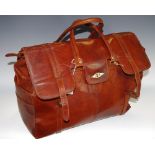 Vintage Luggage - a large leather travel bag.