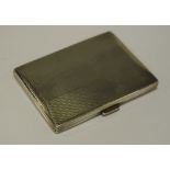 A silver cigarette case,