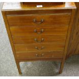 An Edwardian mahogany five drawer music cabinet, with contents of sheet music, booklets, inc Folk,