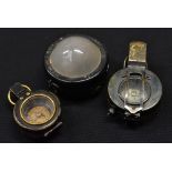 A WWI marching compass Stanley London 1914; another smaller;