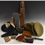 A collection of WWII and later militaria, including belts, gas mask, a machete,