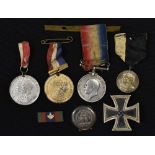 Medals: a tin box containing 1939-45 German iron cross 1st class badge with rear bar attachment;