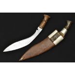 A large kukri, crescent moon armory marking to the blade; another,
