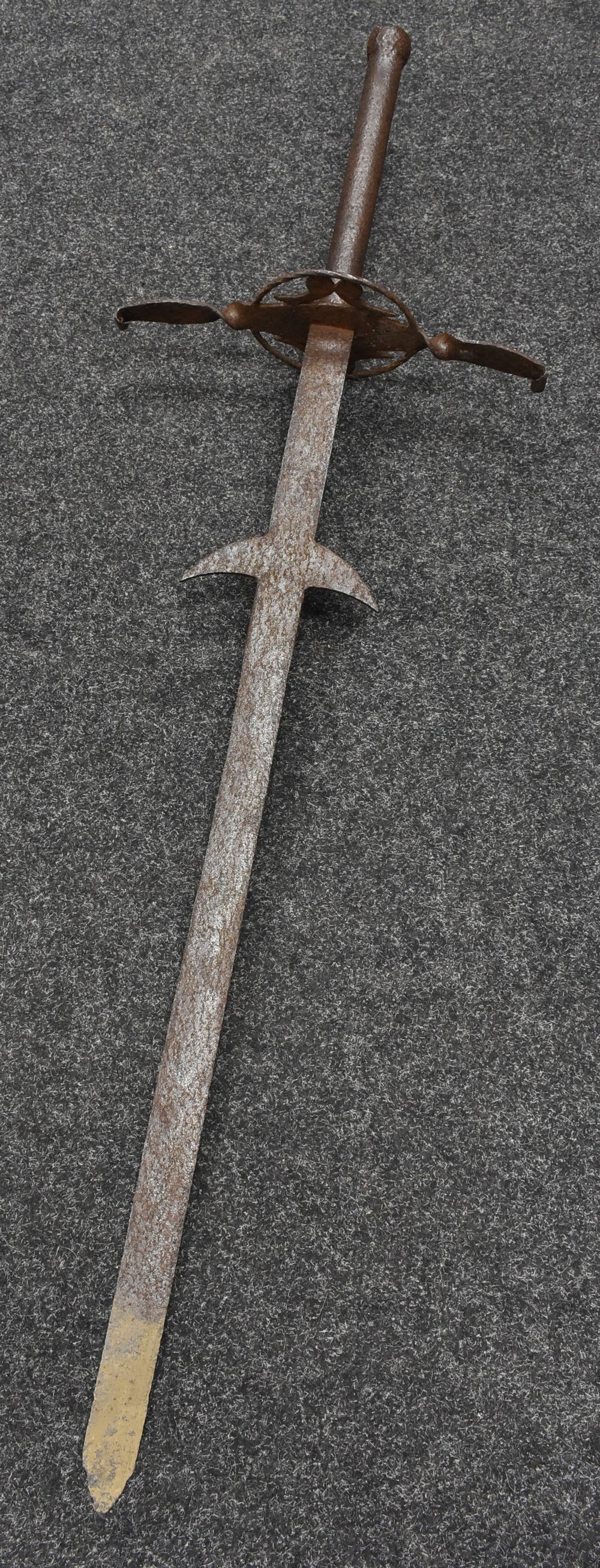 A substantial 19th century Historicist iron funerary sword, of Medieval form,