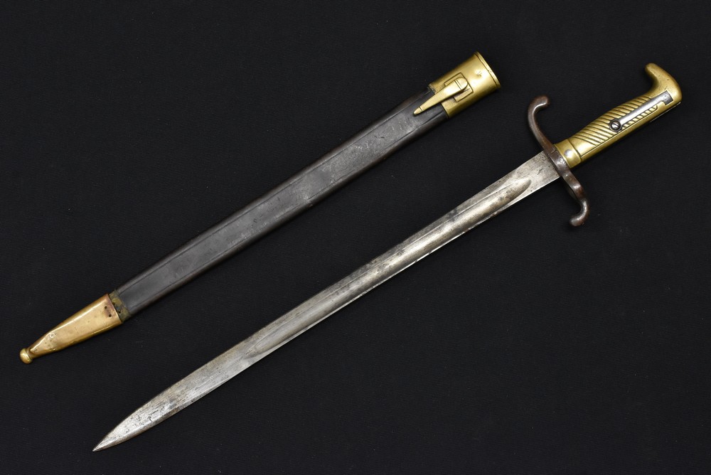 A Prussian M1871 Mauser Bayonet, the blade marked Alex Coppel Solingen, and dated 1874 to the spine,