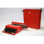 A mid 20th century Olivetti retro portable typewriter, bright red,