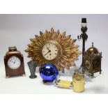 An Edwardian table clock; a Smiths sunburst style wall clock; a pewter Art Nouveau vase;