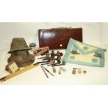 A Masonic suitcase and apron; pipes, folding ruler, pens, travel alarm clock,