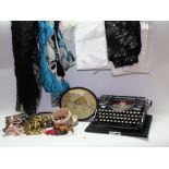 A Continental typewriter, made in Saxony, linen, bead trimmings,