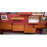A mid-20th century teak octofurcated floating cabinet, comprising shelves, drawers, open bookcase,