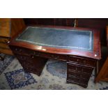 A reproduction mahogany twin pedestal writing desk,