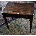 An early 20th century oak side table, rectangular planked top above a frieze drawer, square legs,