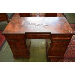 A 19th century walnut writing desk, inverted breakcentre rectangular top above three frieze drawers,