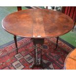 A Victorian walnut Sutherland table, moulded oval top with fall leaves,