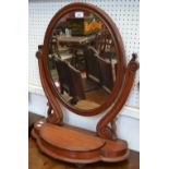 A Victorian mahogany oval dressing table mirror, with hinged compartment, 69cm x 59cm, c.