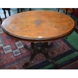 A 19th century walnut centre/loo table, quarter-veneered oval top inlaid with scrolling foliage,