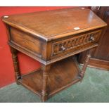 A 17th century style oak side cabinet