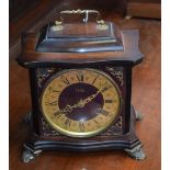 An Odo bracket style mantel clock, brass dial, twin winding holes, Roman and Arabic numerals,